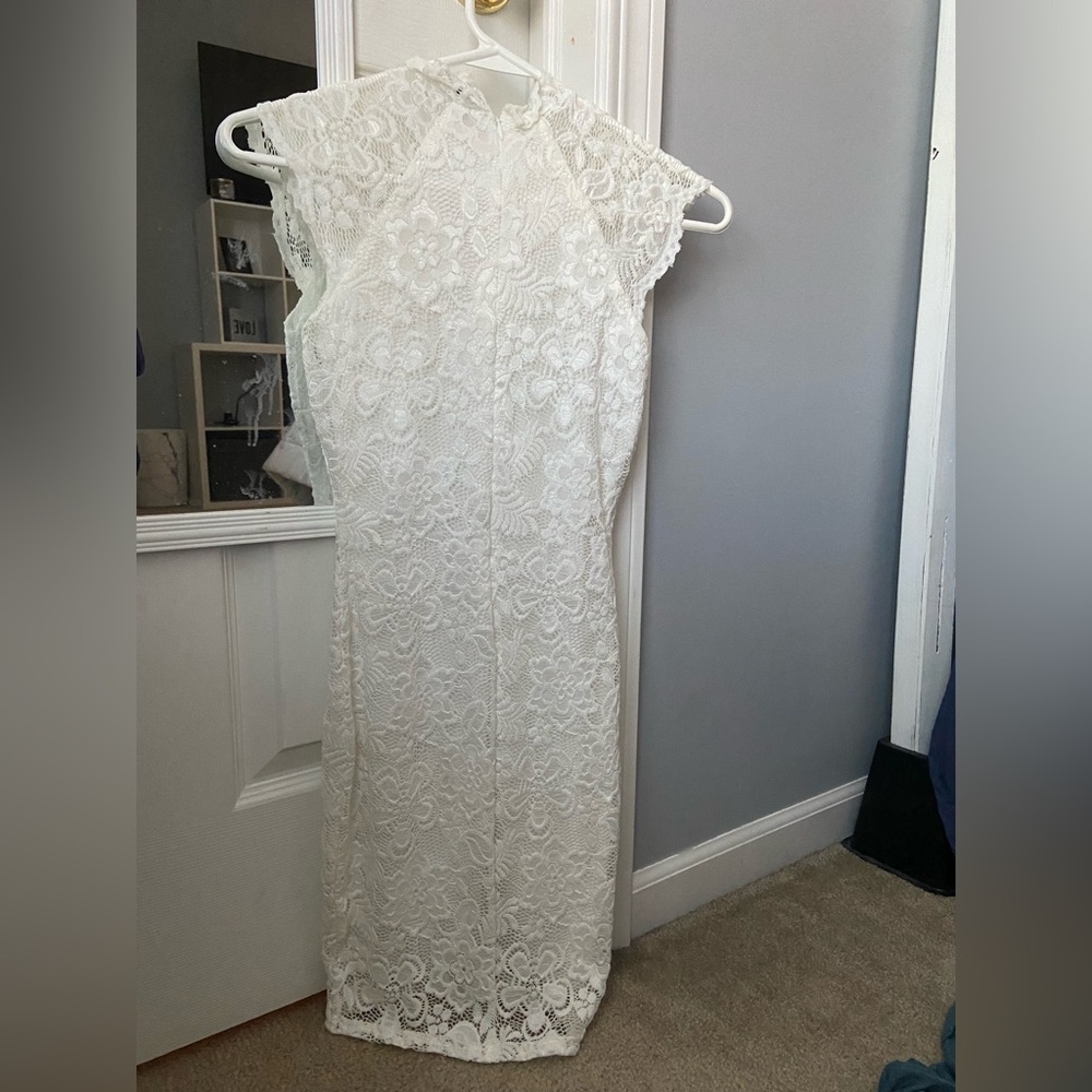 Tight fitting white dress.